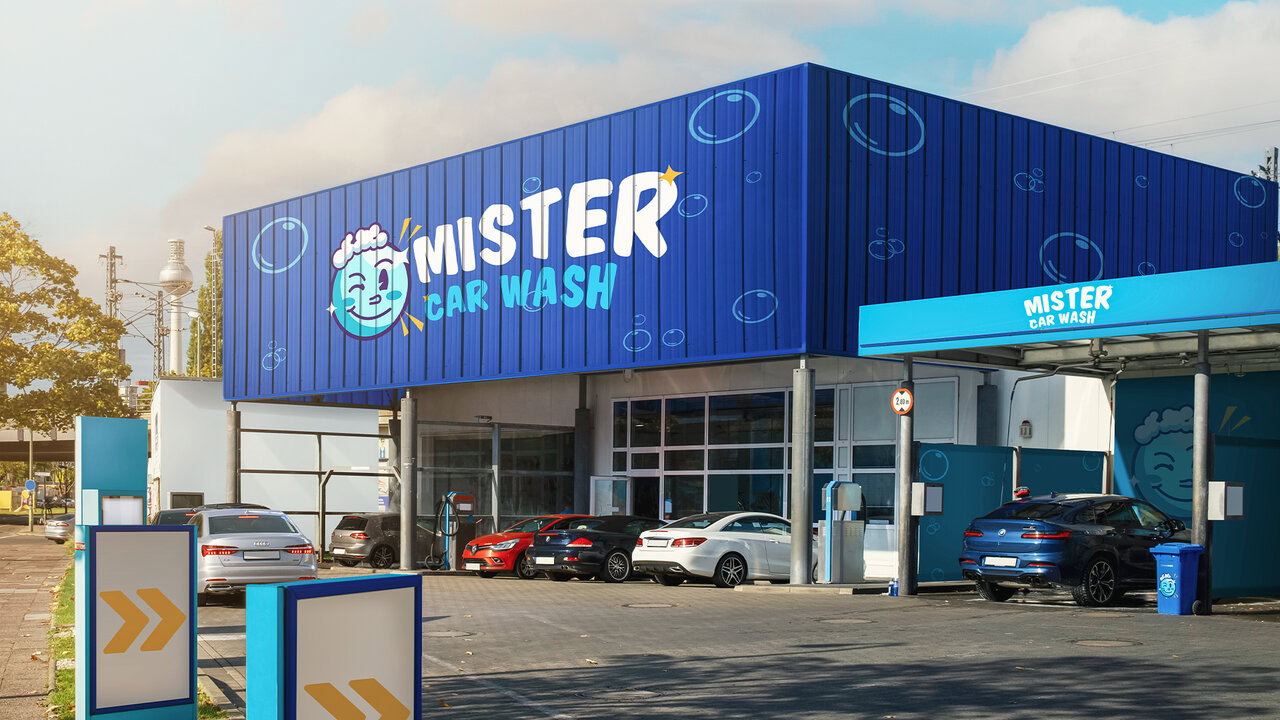 Nebly-Mister-Carwash-fachada Exterior de un establecimiento de Mister Car Wash. Colores vibrantes y diseño moderno. Servicio de autolavado